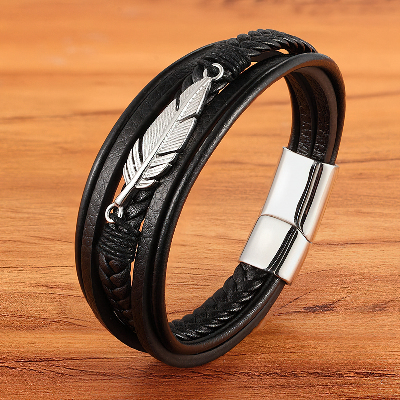 Stylish black leather bracelet with stainless steel feather detail, perfect for men and women.