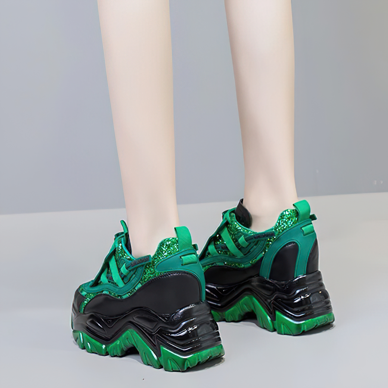 Back view of stylish green and black chunky platform sneakers for women, perfect for casual wear and trendy outfits.