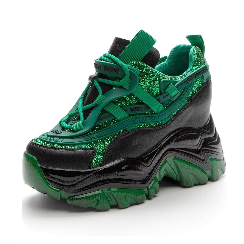 Fashionable green and black chunky platform sneakers with glitter detailing for women.