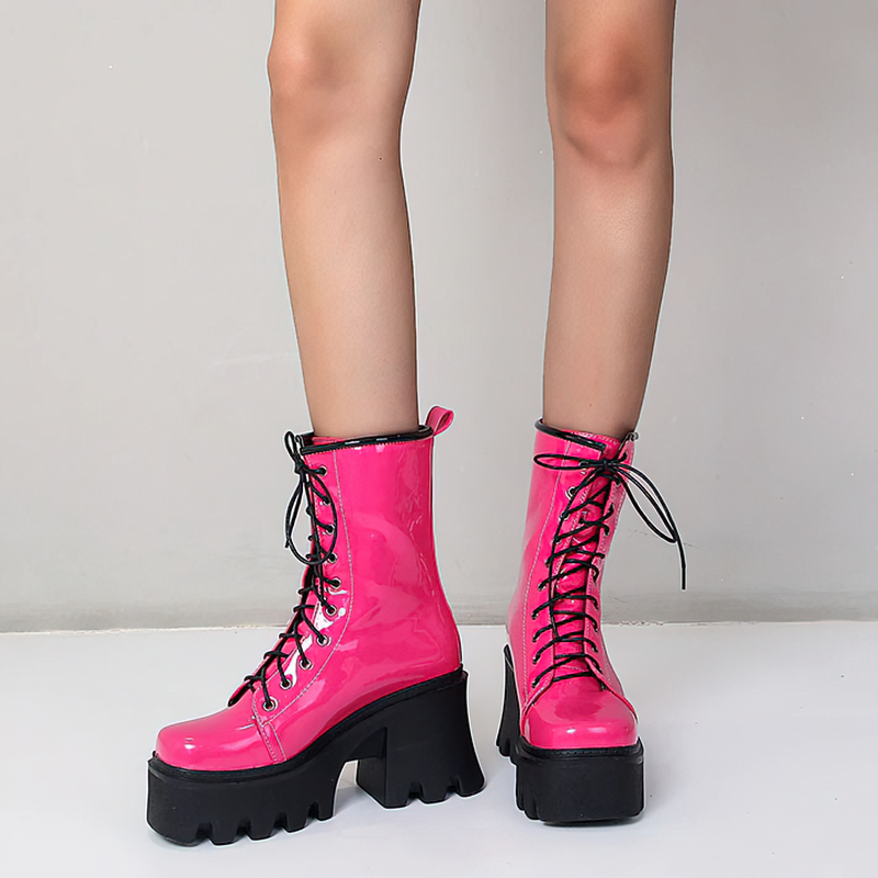 Bold pink genuine leather platform boots with lace-up design, perfect for trendy casual wear.