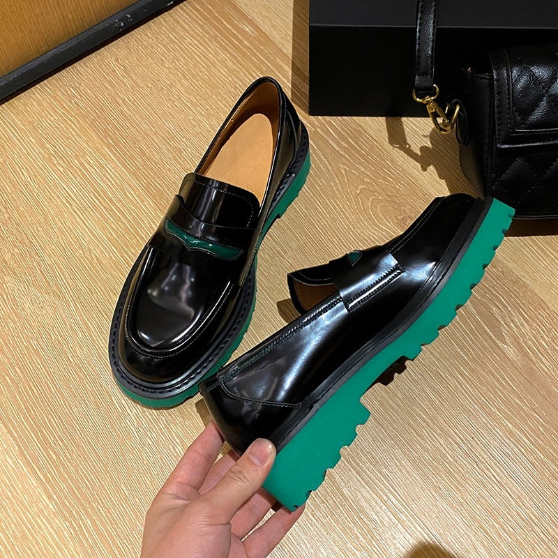 Fashion genuine leather women's black pumps with green platform sole for a stylish and comfortable casual look.