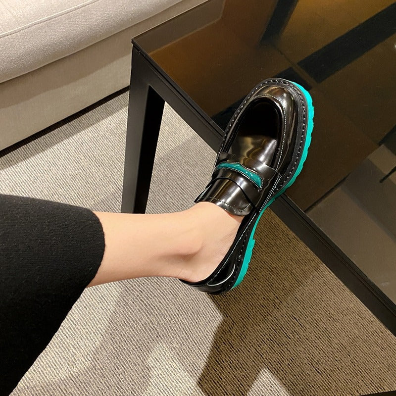 Fashionable black pumps with turquoise sole, showcasing genuine leather comfort and style for casual outfits.