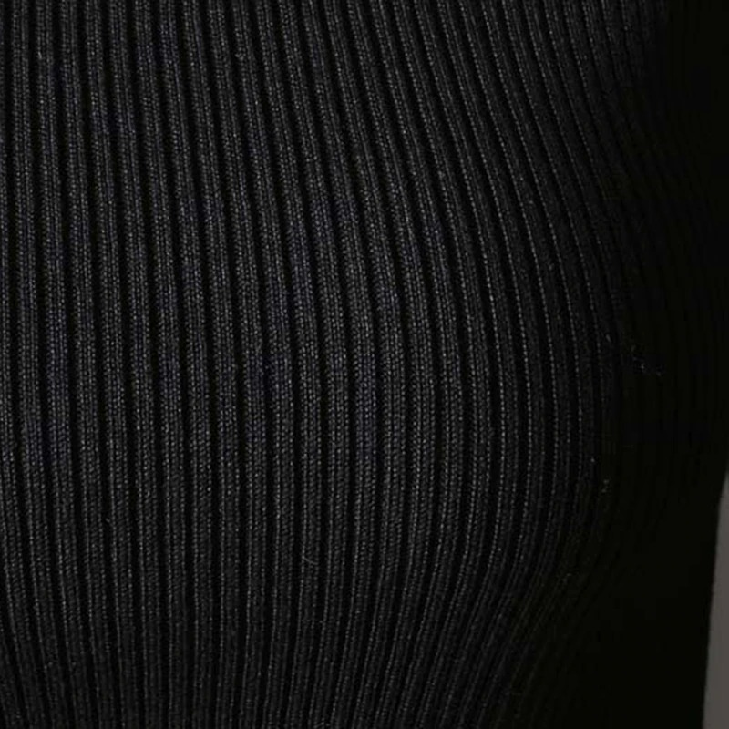 Close-up of a black ribbed fabric, showcasing the texture of a Gothic style women's turtleneck sweater.