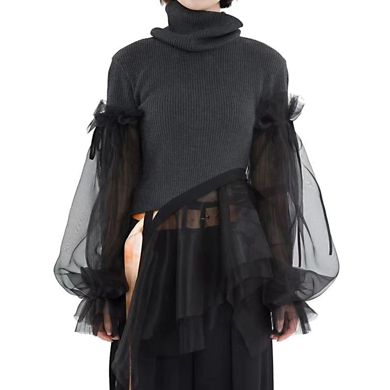 Gothic style black women's turtleneck sweater with long sheer sleeves, perfect for alternative fashion and photoshoots.