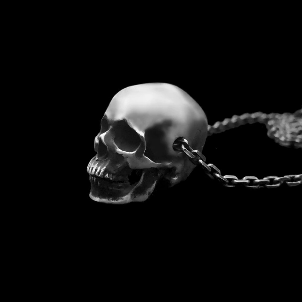 Gothic skull pendant necklace in copper silver color, perfect for unisex gothic jewelry outfits.