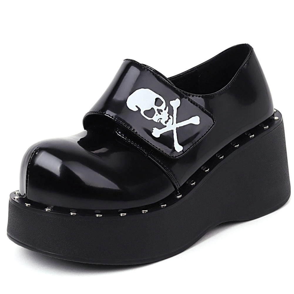 Gothic platform shoes for women in black patent leather with skull design and hook loop strap.