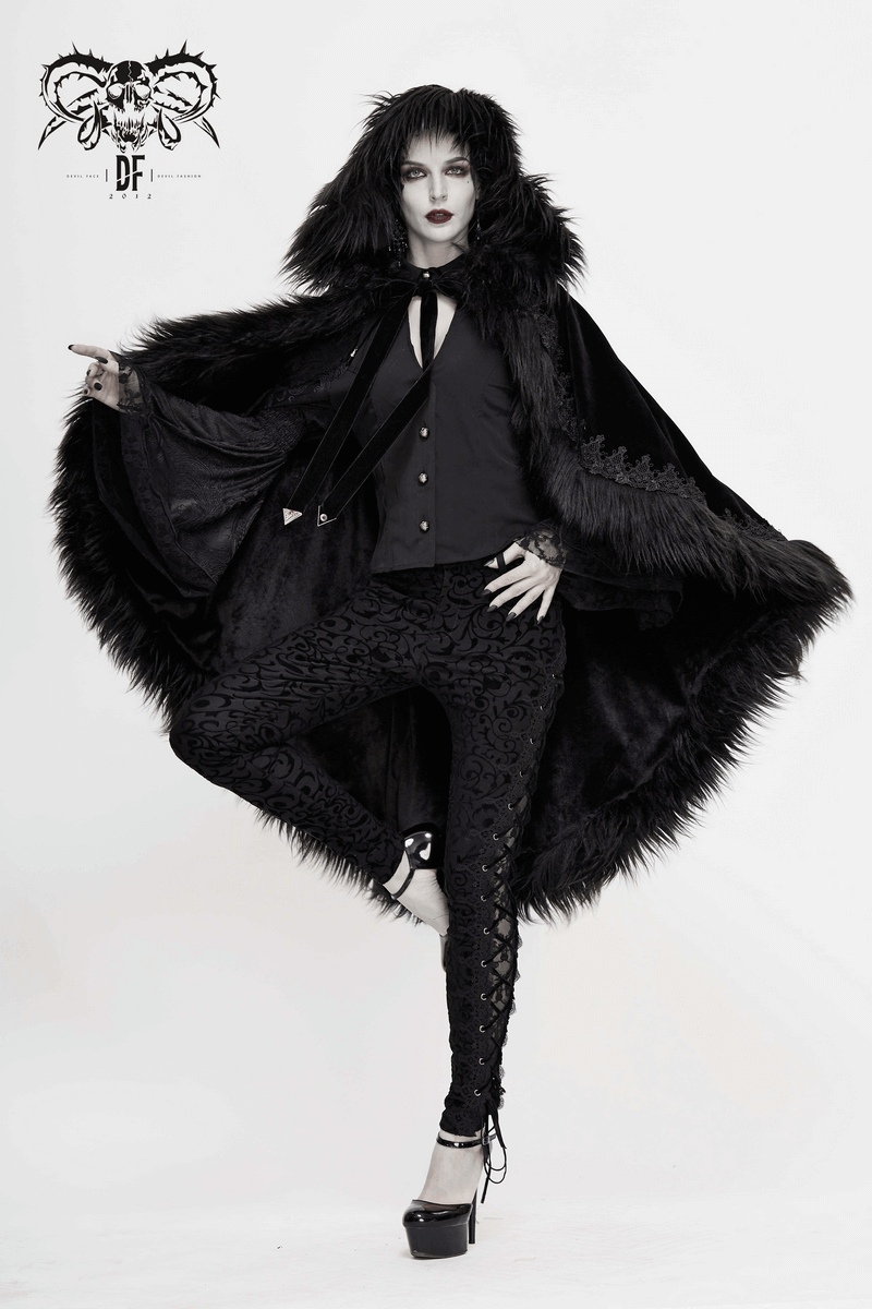 Fashionable women's black velvet hooded cloak with fur accents, styled in gothic fashion, perfect for chic outfits.