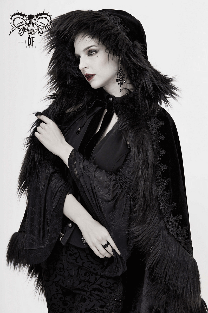 Elegant woman in a gothic style black velvet hooded cloak with fur inserts, showcasing retro fashion.