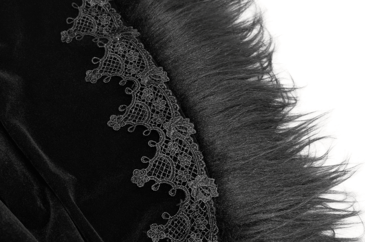 Close-up of a black velvet cloak with intricate lace and fur detailing, perfect for gothic fashion.
