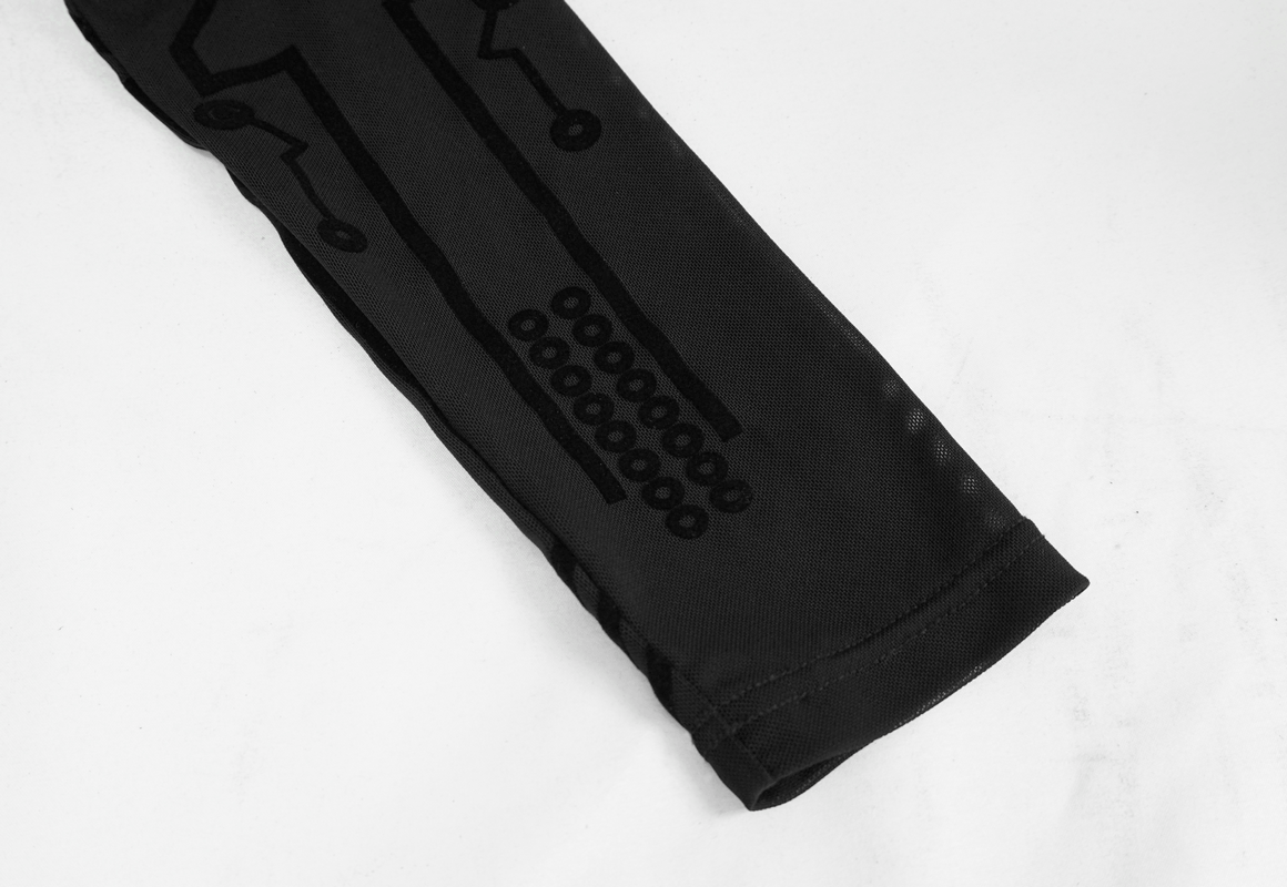 Close-up of mesh sleeve detail on a black cyberpunk dress featuring unique circuit patterns.