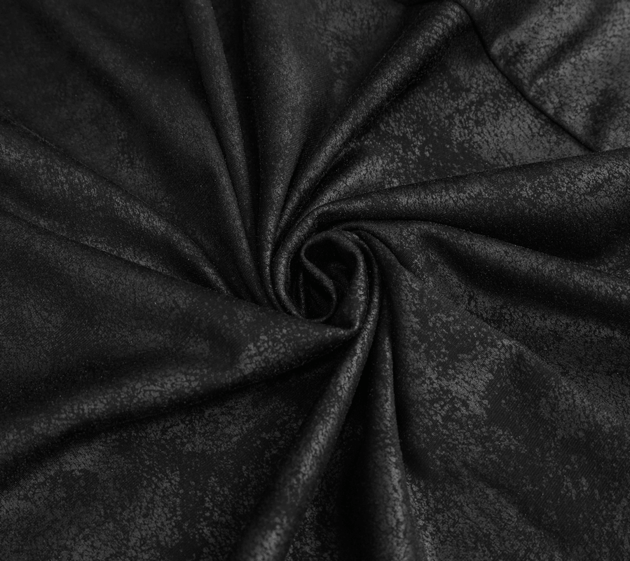 Close-up of luxurious black velvet fabric with a shiny finish, perfect for gothic style fashion.