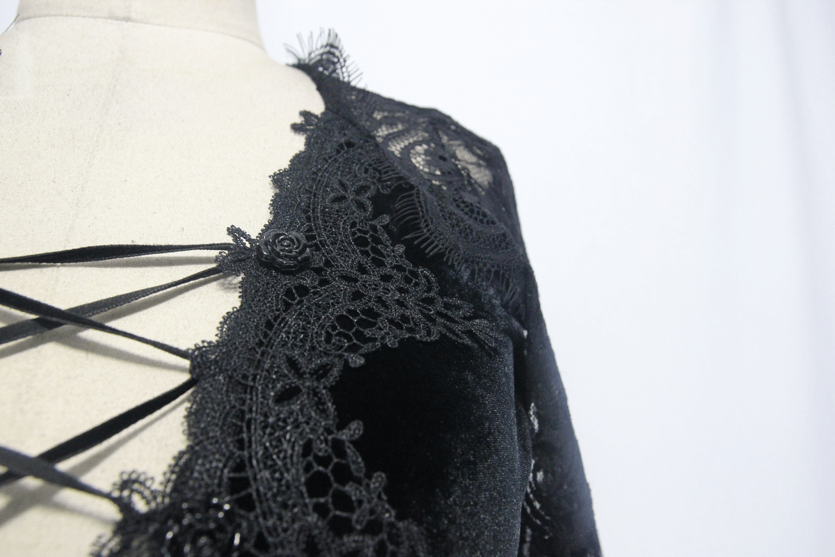Elegant black lace detail on gothic women's mini dress, showcasing luxury and style.
