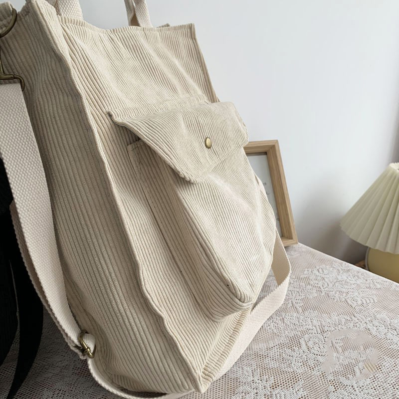 Fashion ladies corduroy handbag in beige, featuring a spacious pocket and stylish design for casual outings.