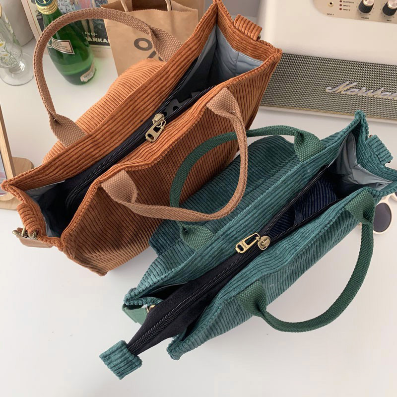 Three stylish ladies corduroy handbags in brown, green, and blue showcasing luxury casual tote design.