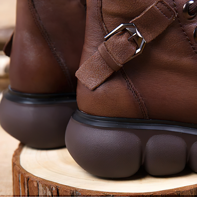 Close-up of brown genuine leather ankle boots with thick platform soles, showcasing trendy casual style for women.