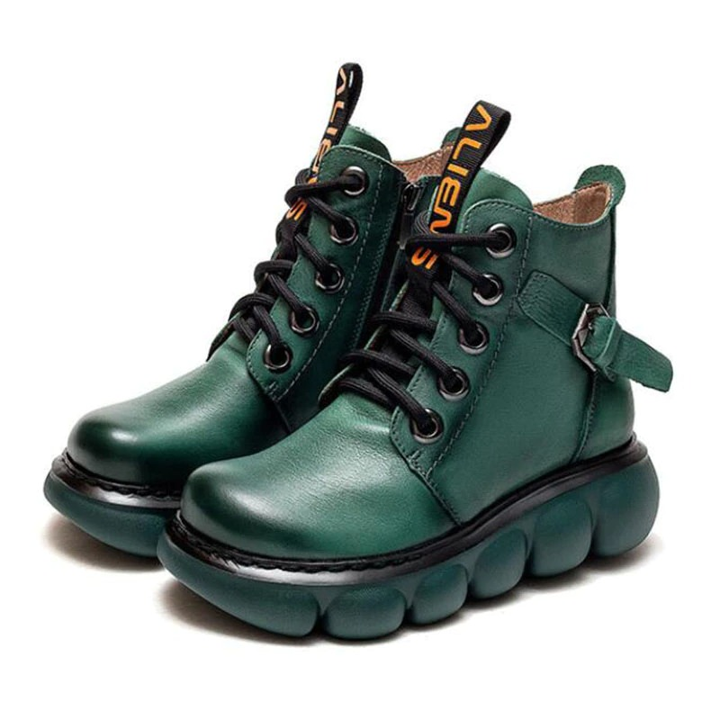 Fashionable green leather ankle boots with chunky sole and stylish laces for women.