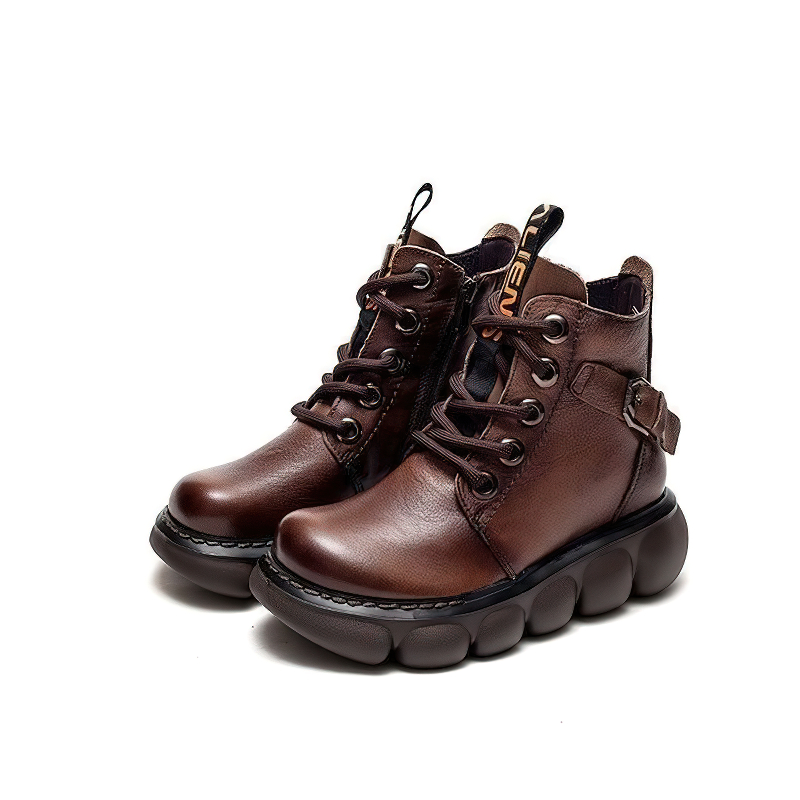 Trendy brown ladies ankle boots made of genuine leather, featuring a round toe and thick platform for stylish comfort.