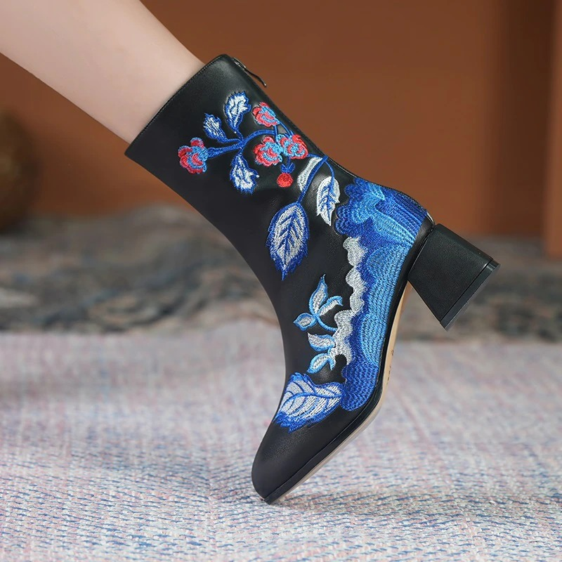 Black ladies genuine leather ankle boots with colorful ethnic embroidery and square heels.
