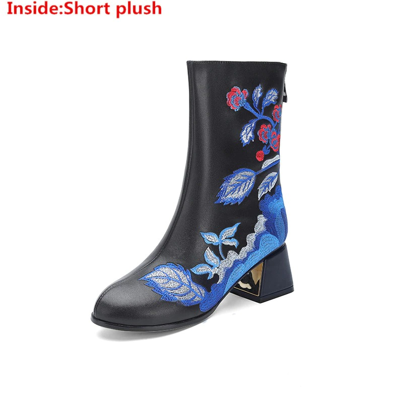 Elegant ethnic style black leather ankle boots with embroidered floral pattern and square heels.