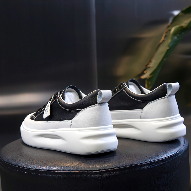 Fashion ladies lace-up genuine leather sneakers with a sleek design and comfortable platform sole.