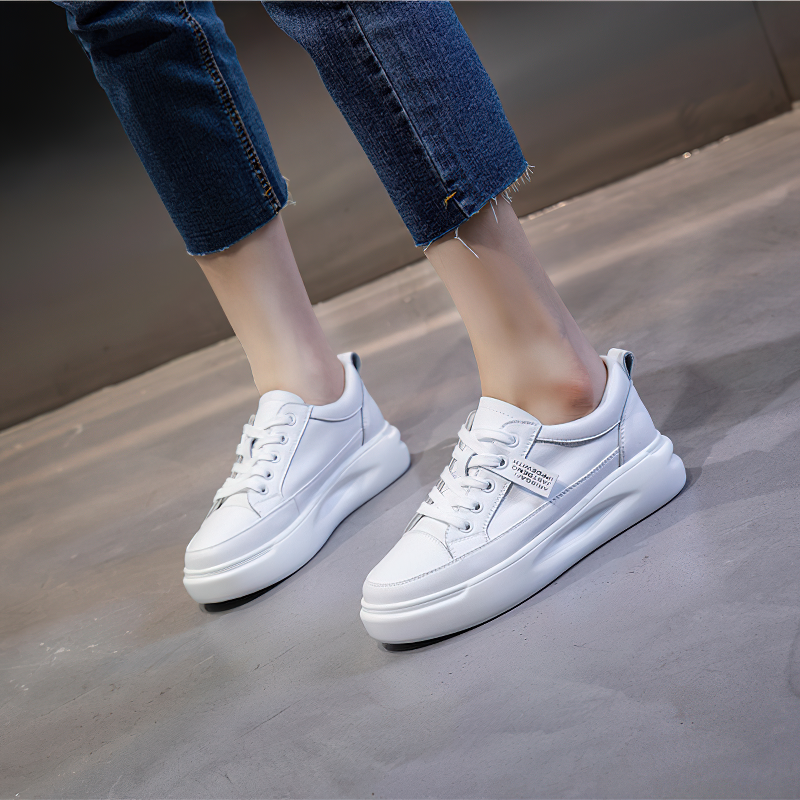 Fashion ladies lace-up genuine leather sneakers in white, perfect for casual outfits and stylish comfort.