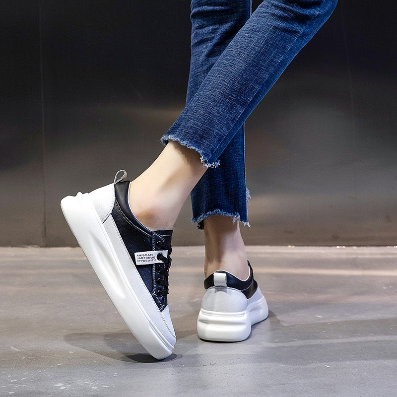 Fashion ladies lace-up genuine leather sneakers with a stylish 3-5cm platform and casual denim outfit.