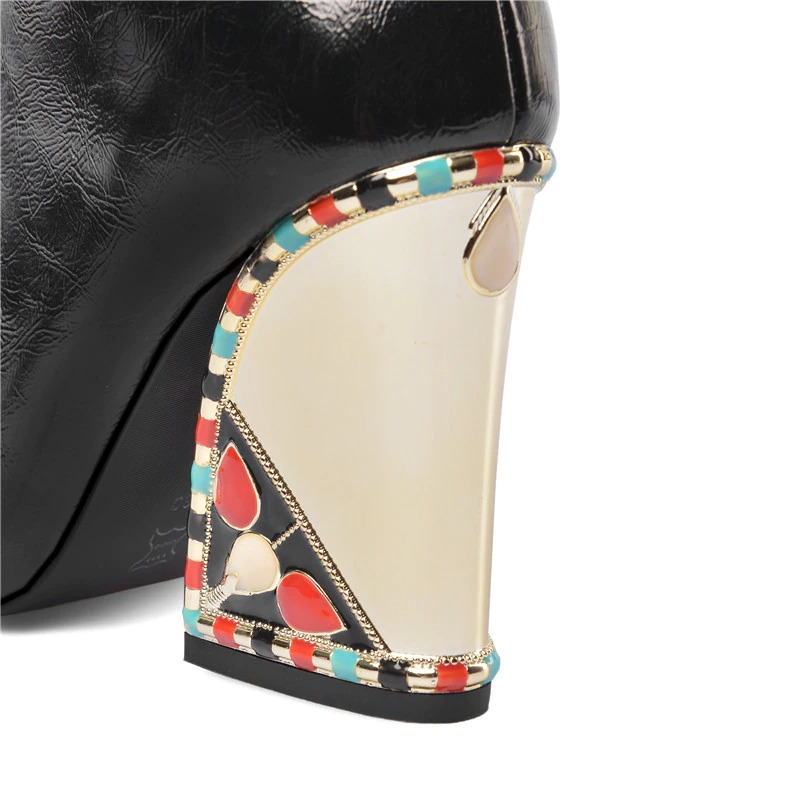 Close-up of women's black mid-calf boot heel, featuring colorful ethnic-inspired design and gold accents, ideal for stylish comfort.