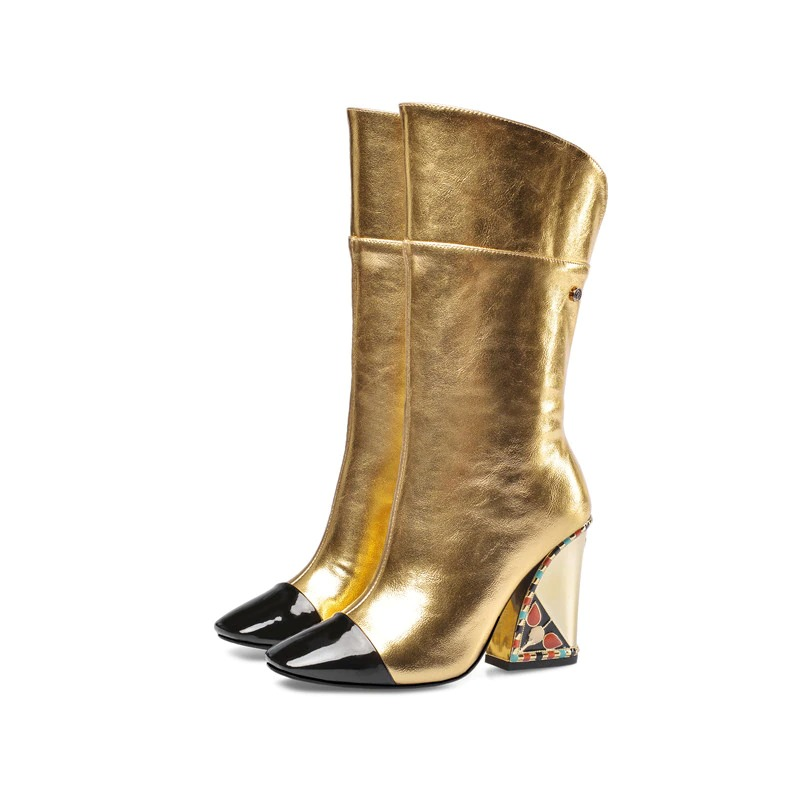 Gorgeous gold mid-calf boots with black patent tips and creative heel design, perfect for stylish women's footwear.