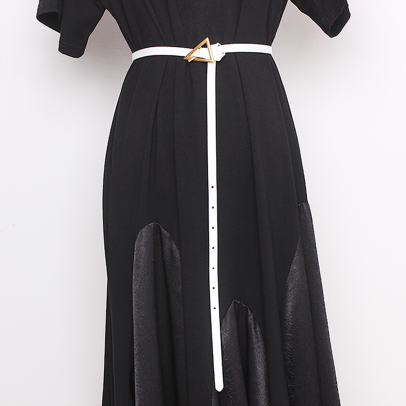 Elegant white PU leather belt with metal triangle buckle on a black dress, perfect for trendy fashion outfits.