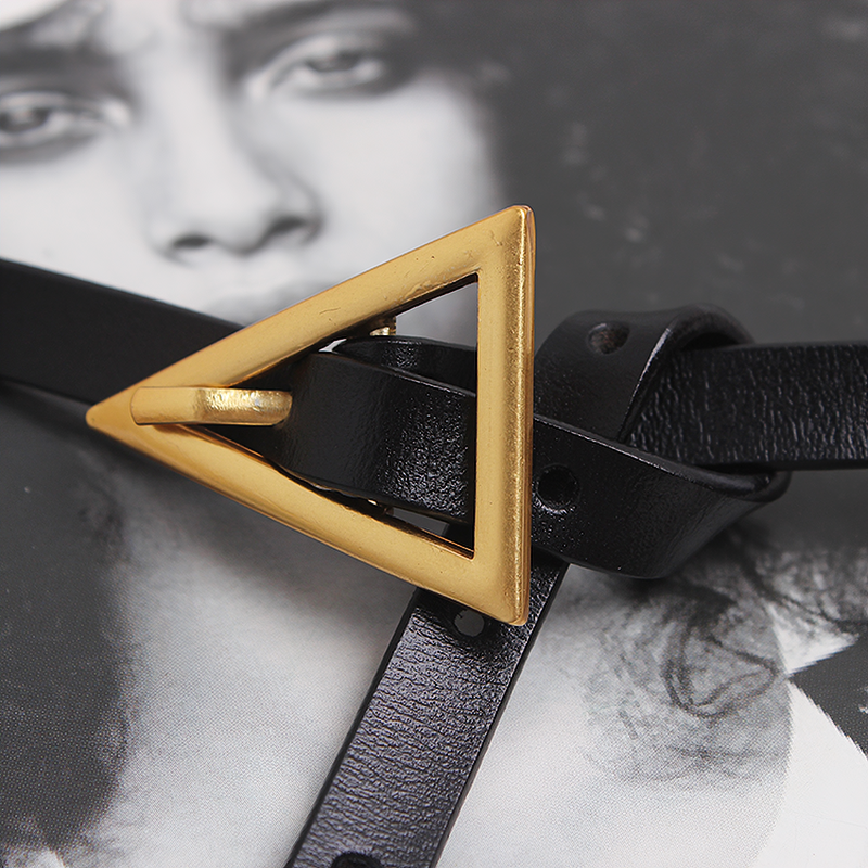 Elegant PU leather belt featuring a stylish metal triangle buckle on a chic black backdrop.