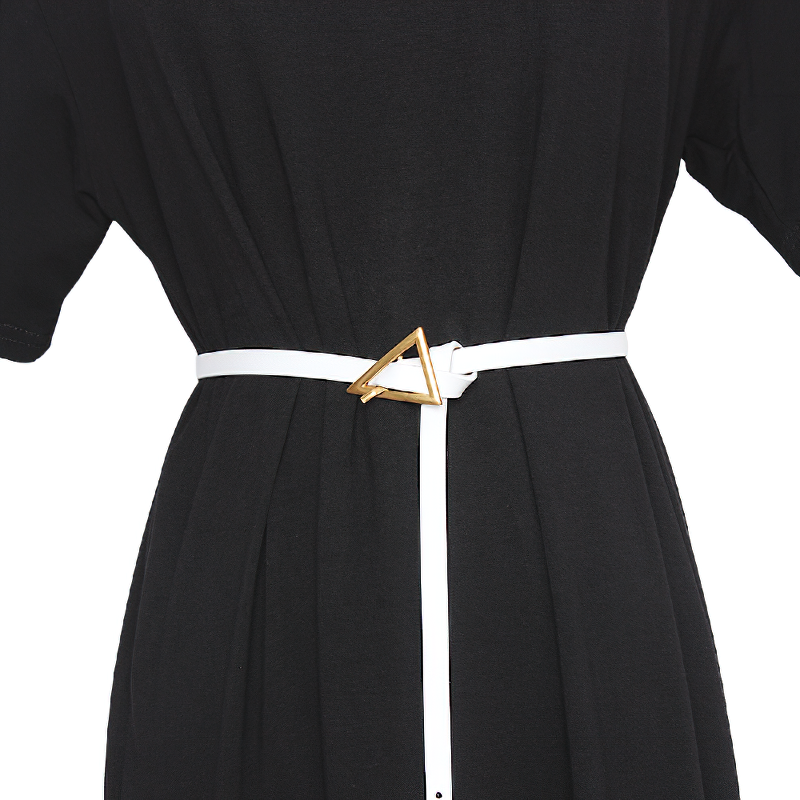 Elegant white PU leather belt with a gold triangle buckle on a black dress, adding a geometric touch to the outfit.