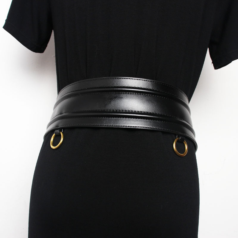Trendy black wide PU leather corset belt with gold metal buckles, perfect for elevating any outfit.