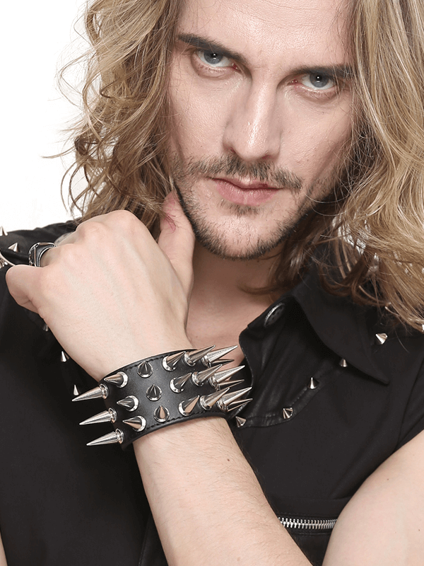 Stylish unisex punk bracelet with silver spikes on a model's wrist, perfect for edgy outfits.