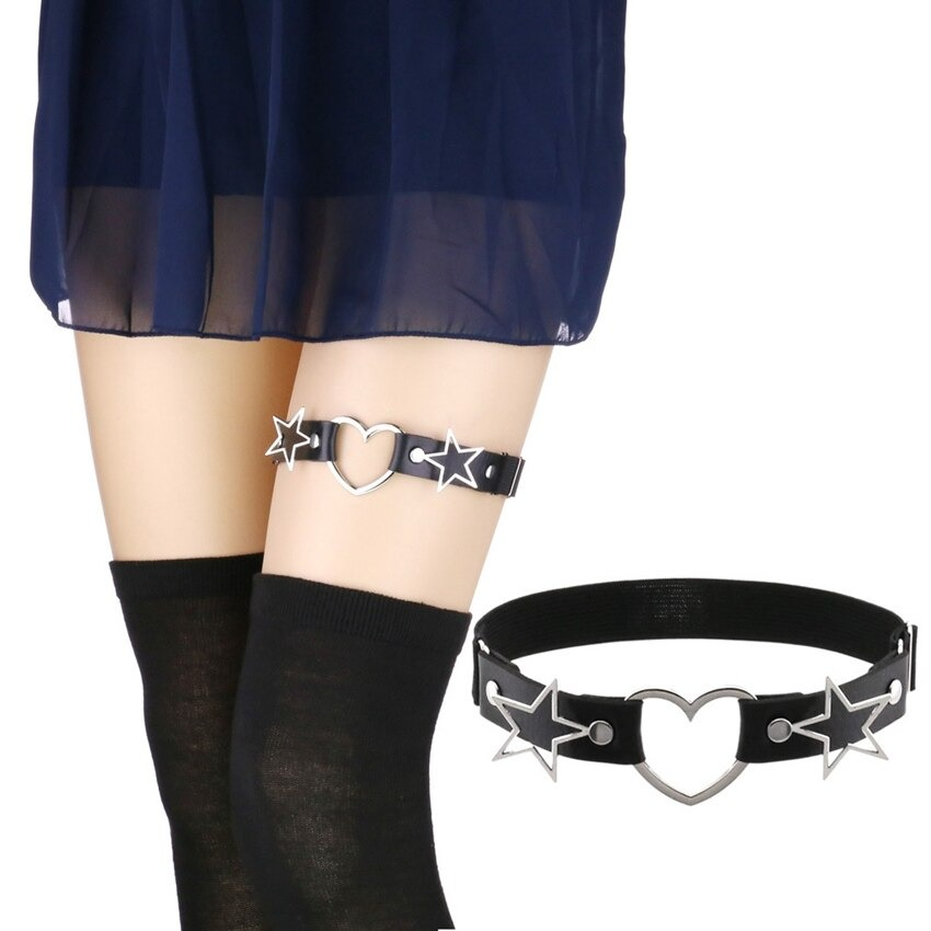 Fashionable thigh harness with heart and star metal accents, PU leather garter belt for edgy gothic style.