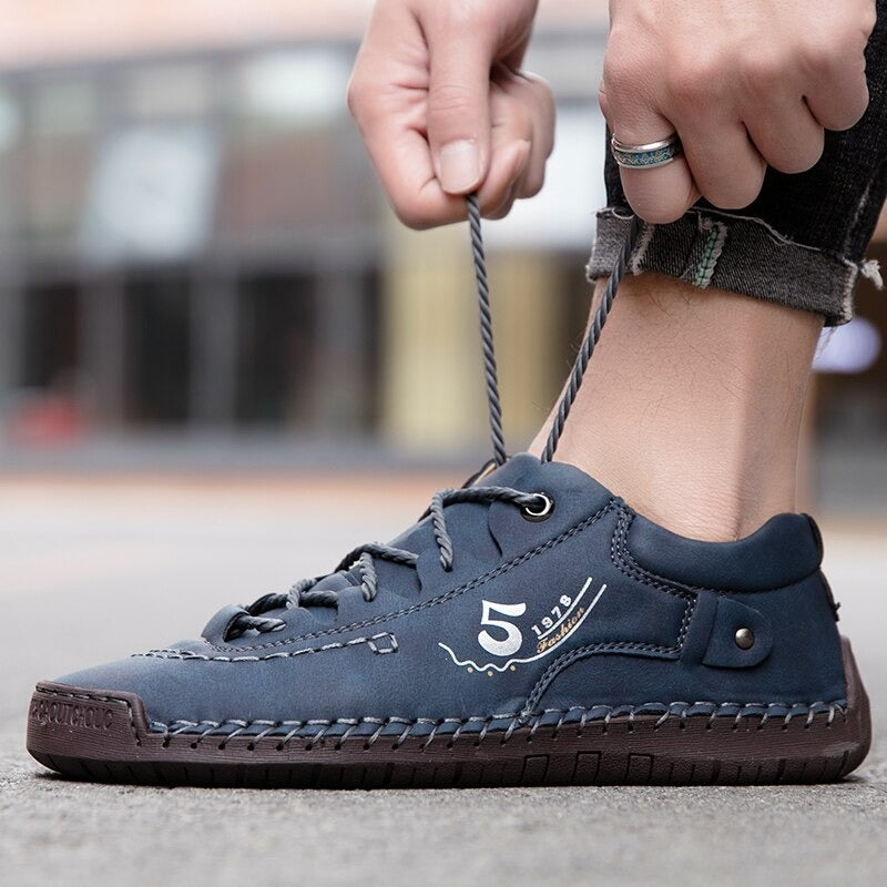Men's casual blue loafers with stitching details and lace-up design, perfect for spring and summer outings.