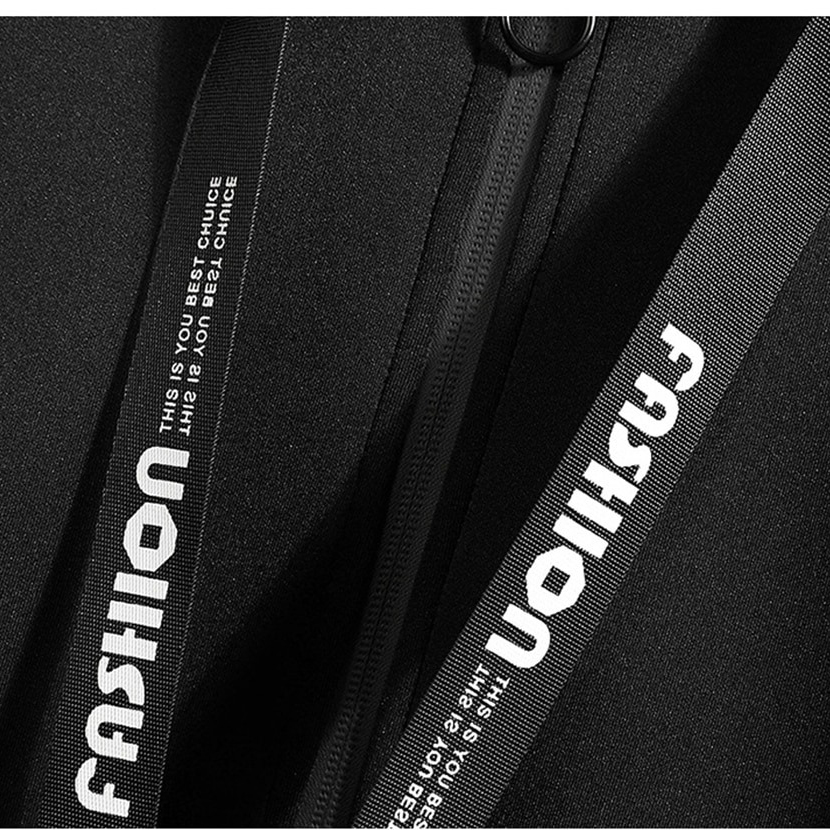 Close-up of the stylish zipper detail on a fashionable men's coat with stylish branding.