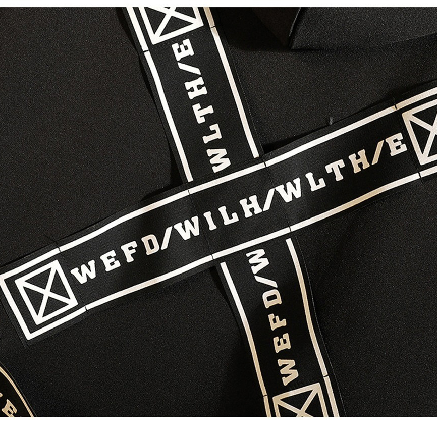 Close-up of black fabric with striking white printed straps featuring creative text design for men's coat fashion.