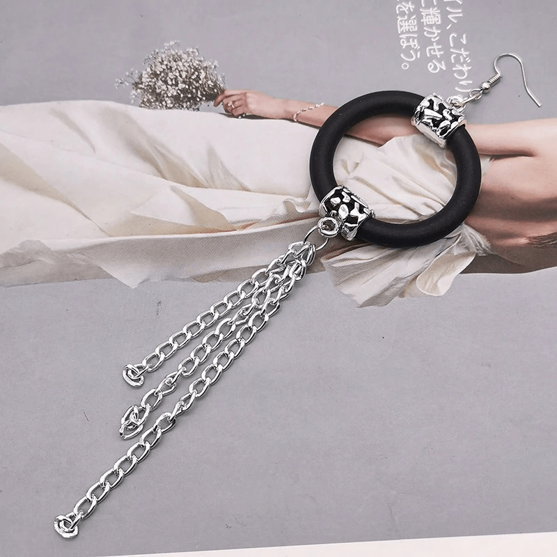 Handmade women's long drop earrings in black rubber with silver chains, perfect boho accessories for stylish outfits.