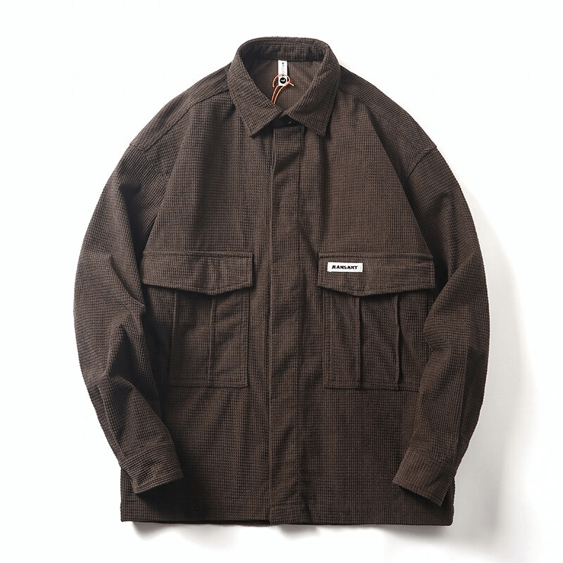 Fashionable men's oversized shirt in brown with two big pockets, ideal for alternative style wardrobe.