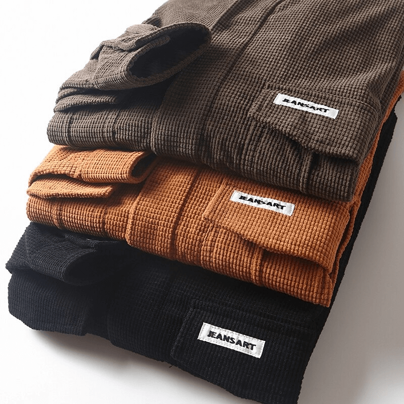 Fashionable stacked long sleeve shirts in brown, orange, and black with front pockets from Jeansart.