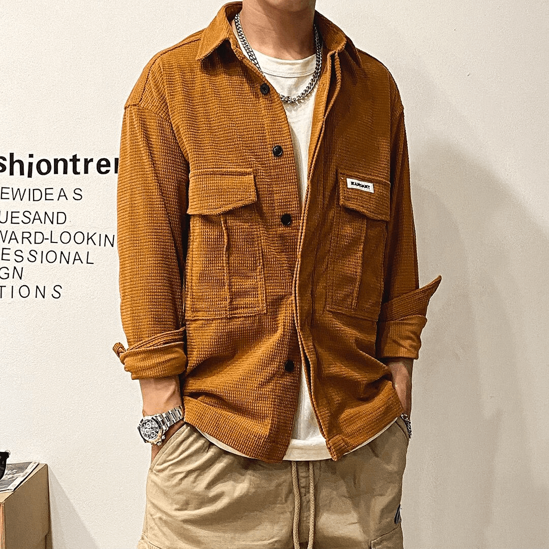 Men's oversized shirt in orange with two big pockets, perfect for alternative style outfits.