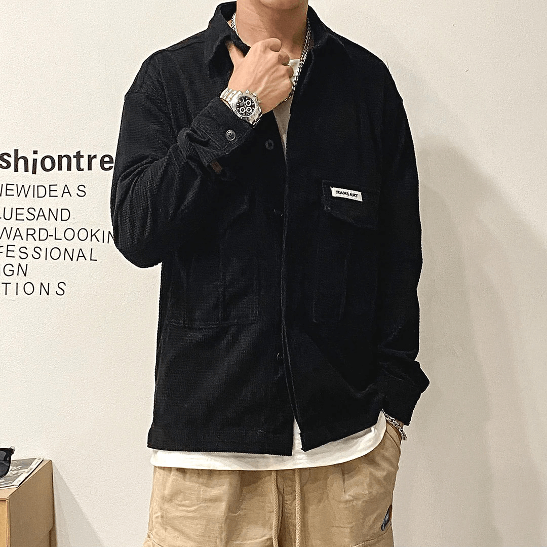 Men's oversized black shirt with two large pockets for an alternative style look.