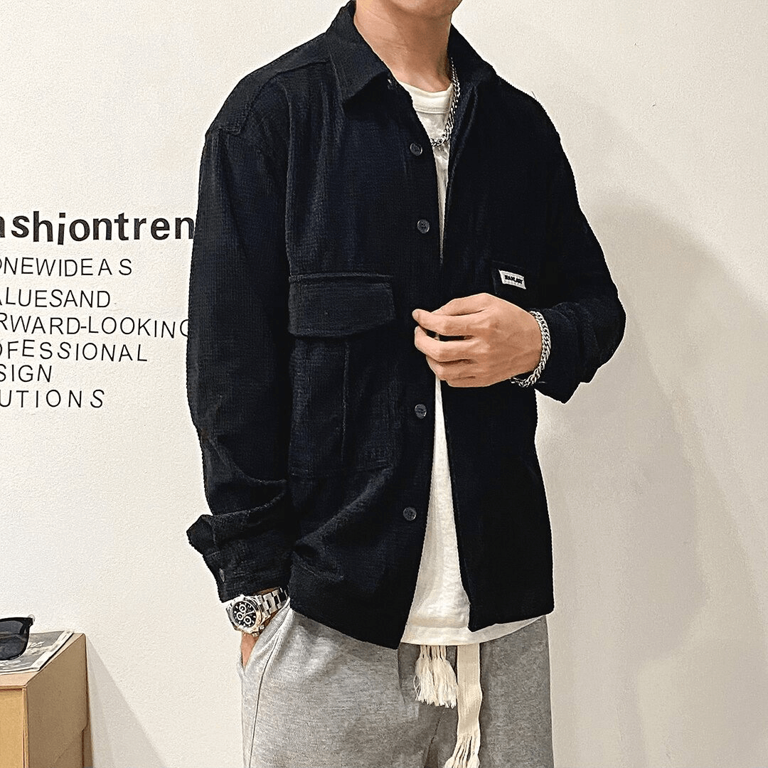 Stylish men's oversized black shirt with two big pockets, perfect for alternative fashion.