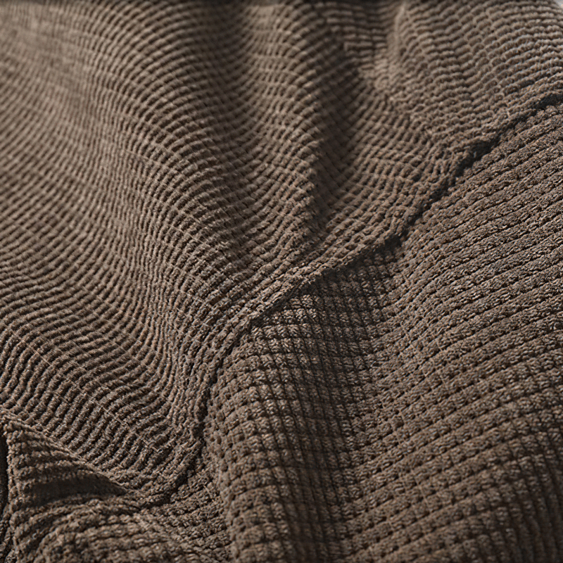 Close-up of textured brown fabric, showcasing a soft and cozy material perfect for oversized male shirts.