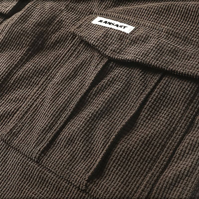 Fashionable men's oversized shirt showcasing two large pockets in a textured brown fabric, perfect for alternative style enthusiasts.