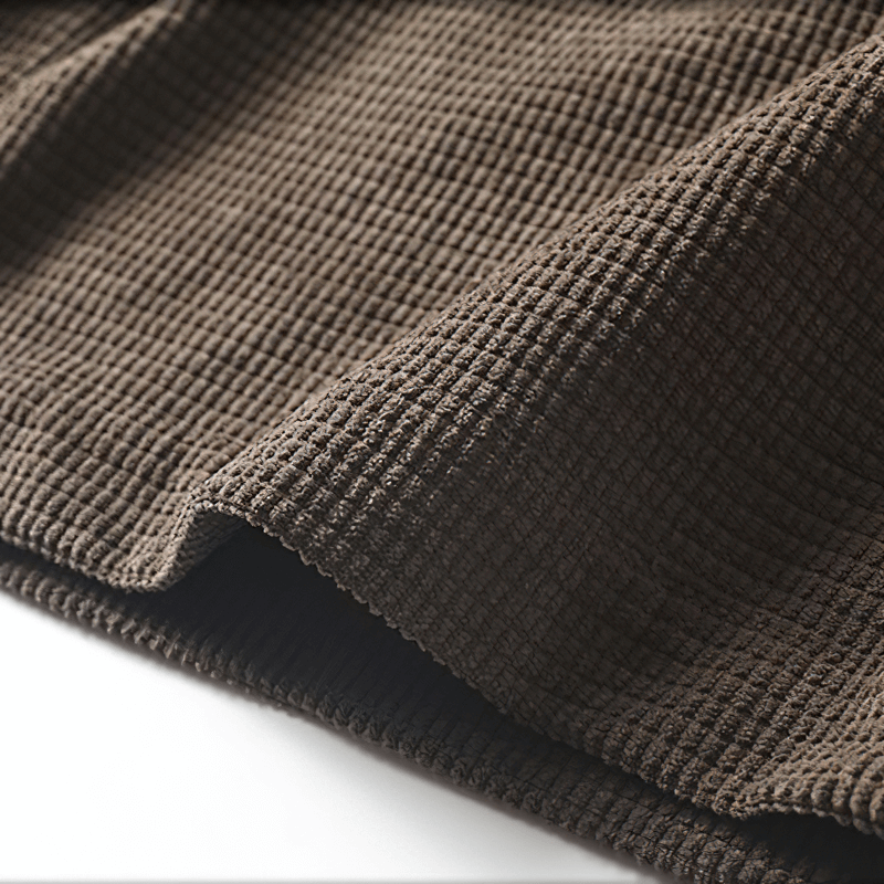 Close-up of textured brown fabric, perfect for fashion oversized shirts with a unique style.
