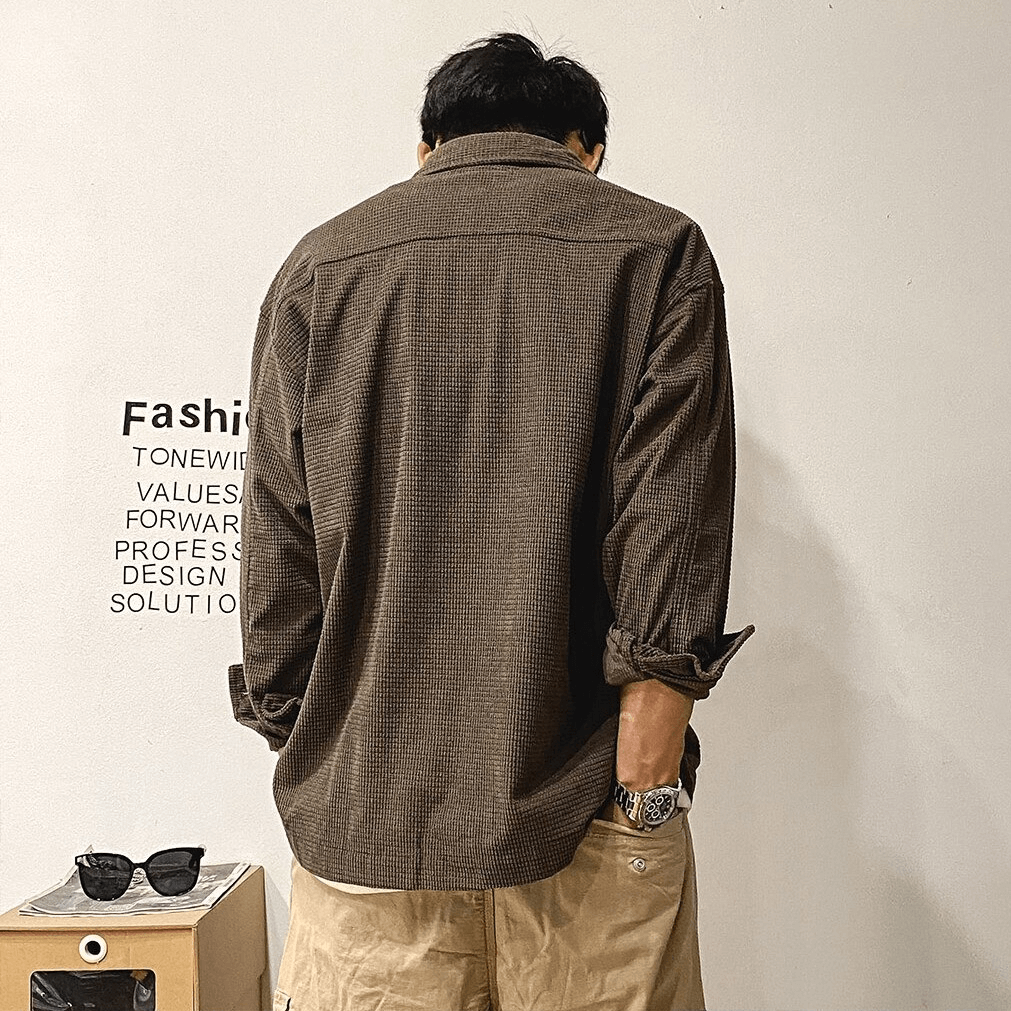 Back view of a men’s oversized shirt with two big pockets in alternative style, perfect for a trendy wardrobe.