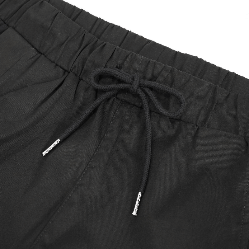 Close-up of elastic waistband with drawstring on stylish men's cargo pants.