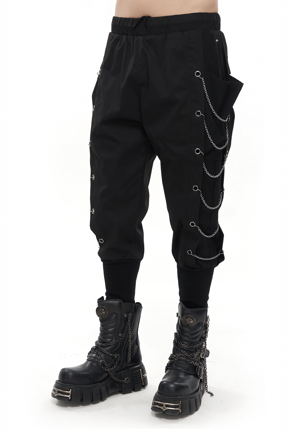 Men's loose cargo pants with chain eyelets and elastic waistband, styled with gothic punk boots.