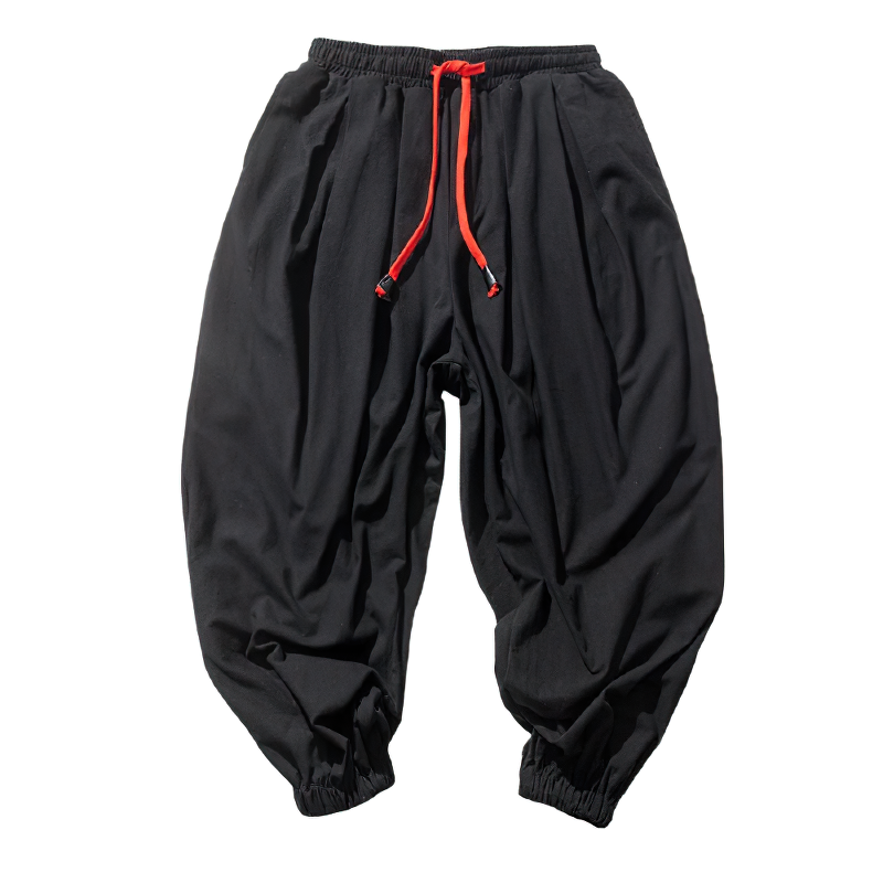 Loose black cotton linen pants for men with red drawstrings, perfect for casual summer style.
